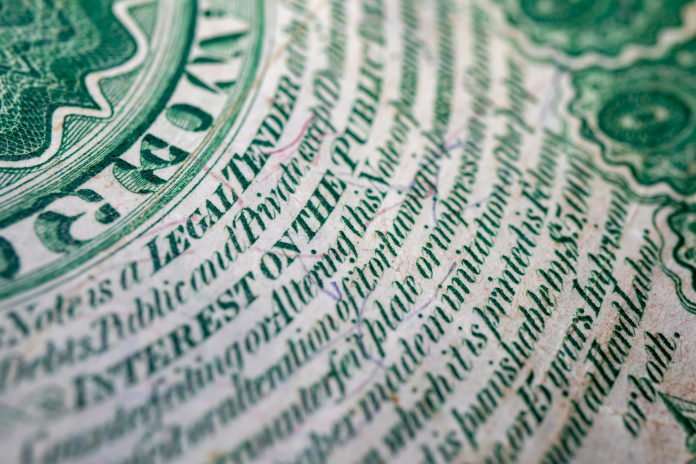 Dollar, détail (photo Andrew Dawes/Unsplash).