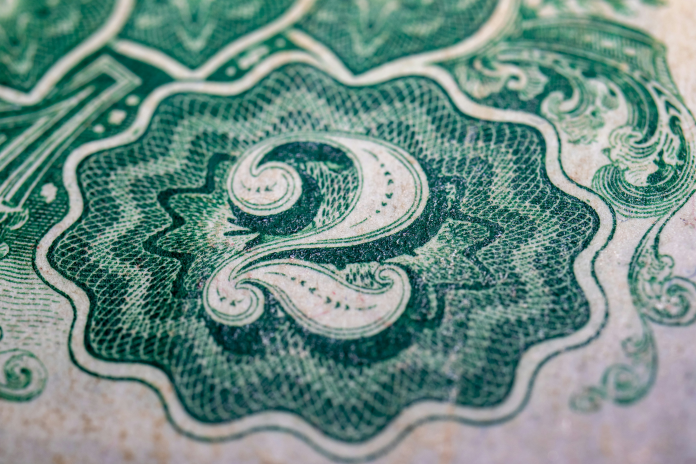 Dollar, détail (photo Andrew Dawes/Unsplash).
