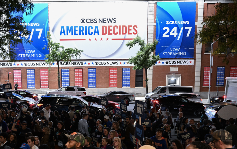 Trump and Harris supporters gather outside of the CBS Studios in New York during Vice Presidential debate