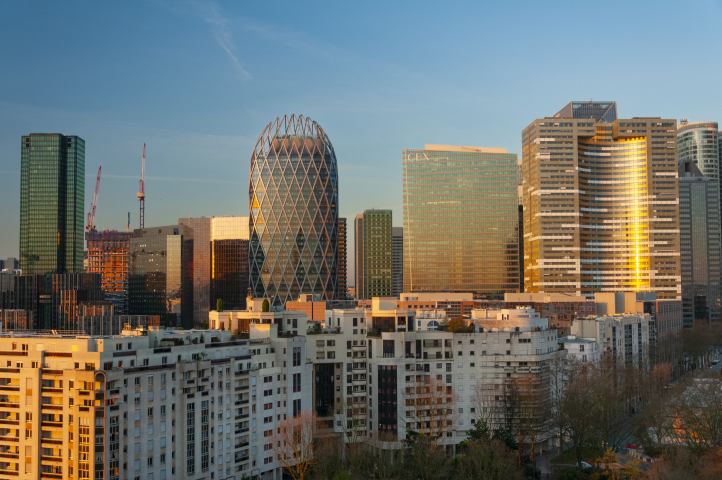 France, Hauts-de-Seine (92), Courbevoie, residential buildings on Place Charras and the Paris La Defense business district at sunrise